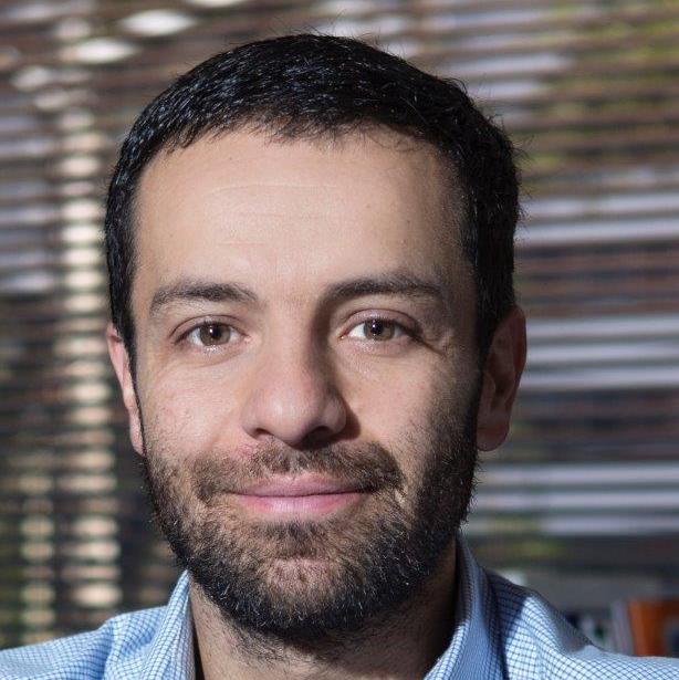 Portrait of Andrés in blue shirt